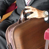 We put shoulder strap to our Brown line. More you use color change every day. Please enjoy the scent of real wood.■ Material: Cedar, cotton canvas, hides, urethane paint (water-repellent finish)■ Size: Approximately W18 X H12 X D2.8 inch, W18 X H15 X D2.8cm (including the handle)■ Weight: Approximately 930 g / 2 lbs■ Specifications: There are 2 middle sizes inner pocket at one side Double fastener make easy open and close B4 size documents storing is possible 17 inches of note PC storing is possible