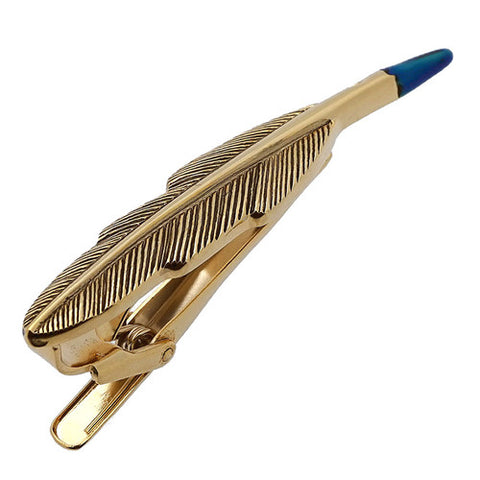 It's a cute Gold Feather Pen Tie Clips. Get this Tie Clip on the website and get delivered in a very beautiful box. Place an order on the website. Size: Approximately 2 5/16" X 7/16" inch. Material: Tin alloy / Brass / Plating process / Epoxy resin. Color: Gold & Blue. Model: T0011